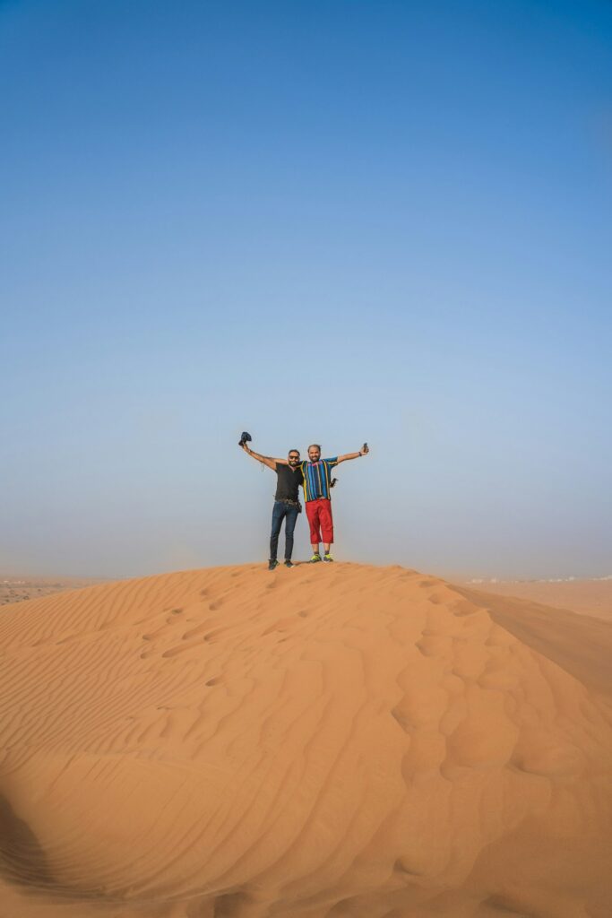 Visitors enjoying a desert dune in the UAE